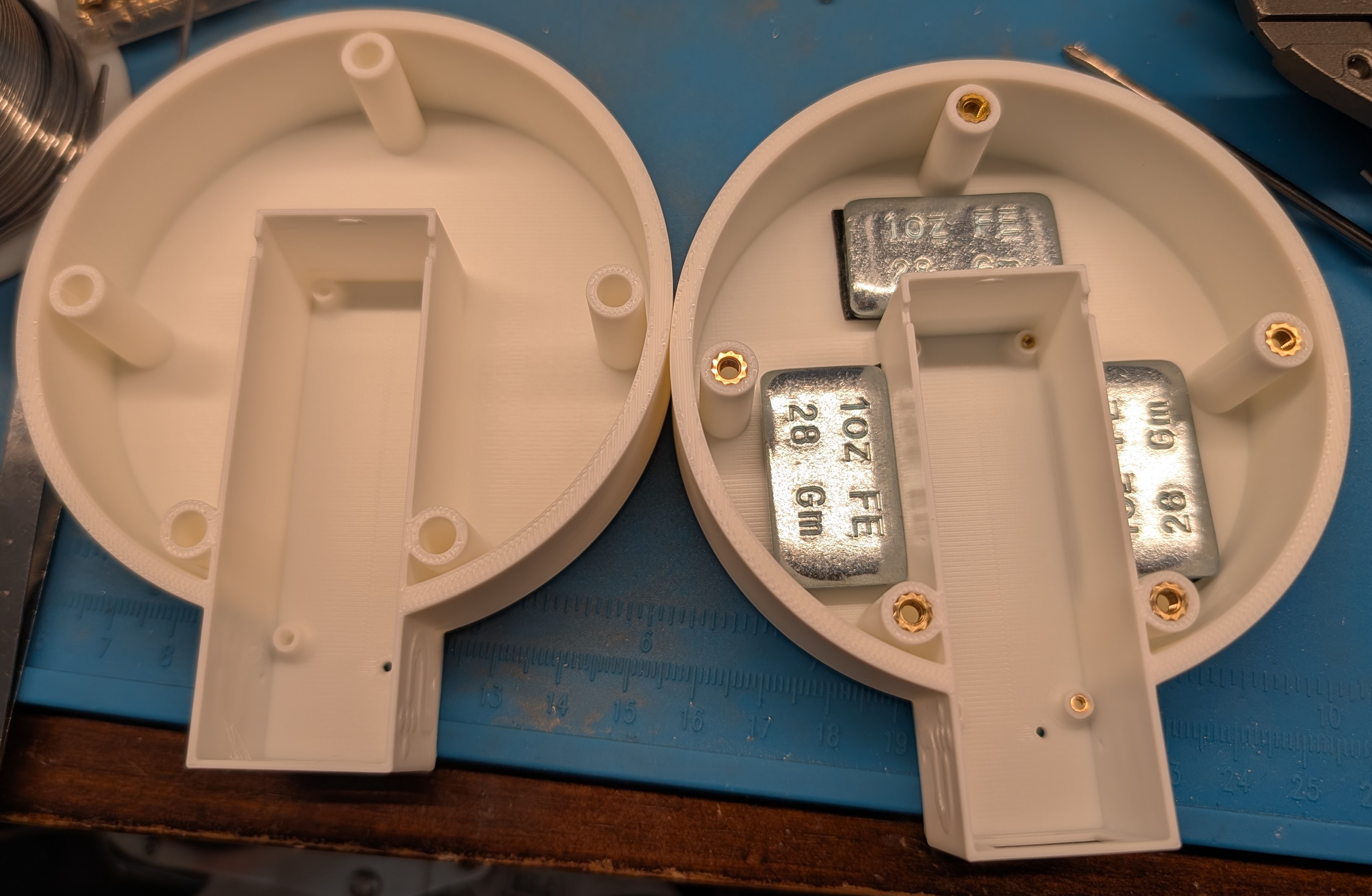 Bare base next to a base with inserts and ballast installed